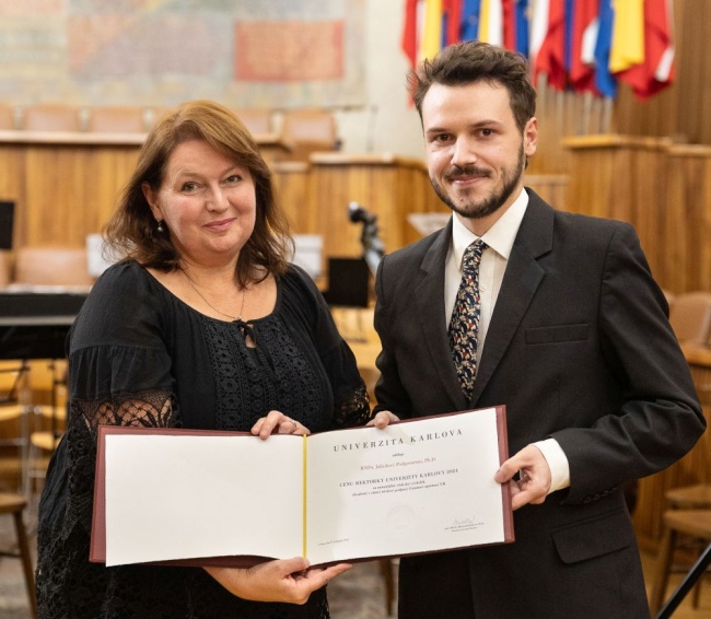 Jakub Podgorný and CU's rector, Milena Králíčková.