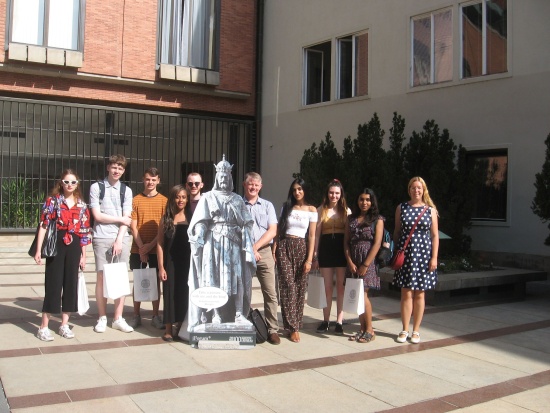Late summer: De Monfort University students take their picture with Charles IV (and pigeon) at the Carolinum in Prague. DMU Lecturer Brian Dodds next to the king (right) and CU's Ivana Herglová at the end of the row (right).